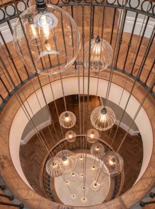 A cluster chandelier is the perfect commercial lighting to make a statement and welcome guests to your premises