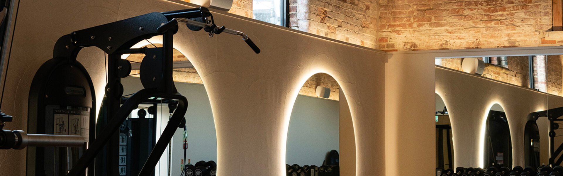 The Woolfox in Leicestershire know that lighting a commercial space can make or break the scheme. Featured here are mirrors in a gym that form part of the lighting scheme design created by Fritz Fryer