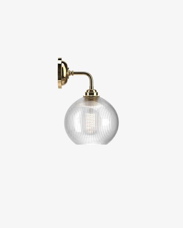 Contemporary wall light in polished brass with skinny ribbed glass shade