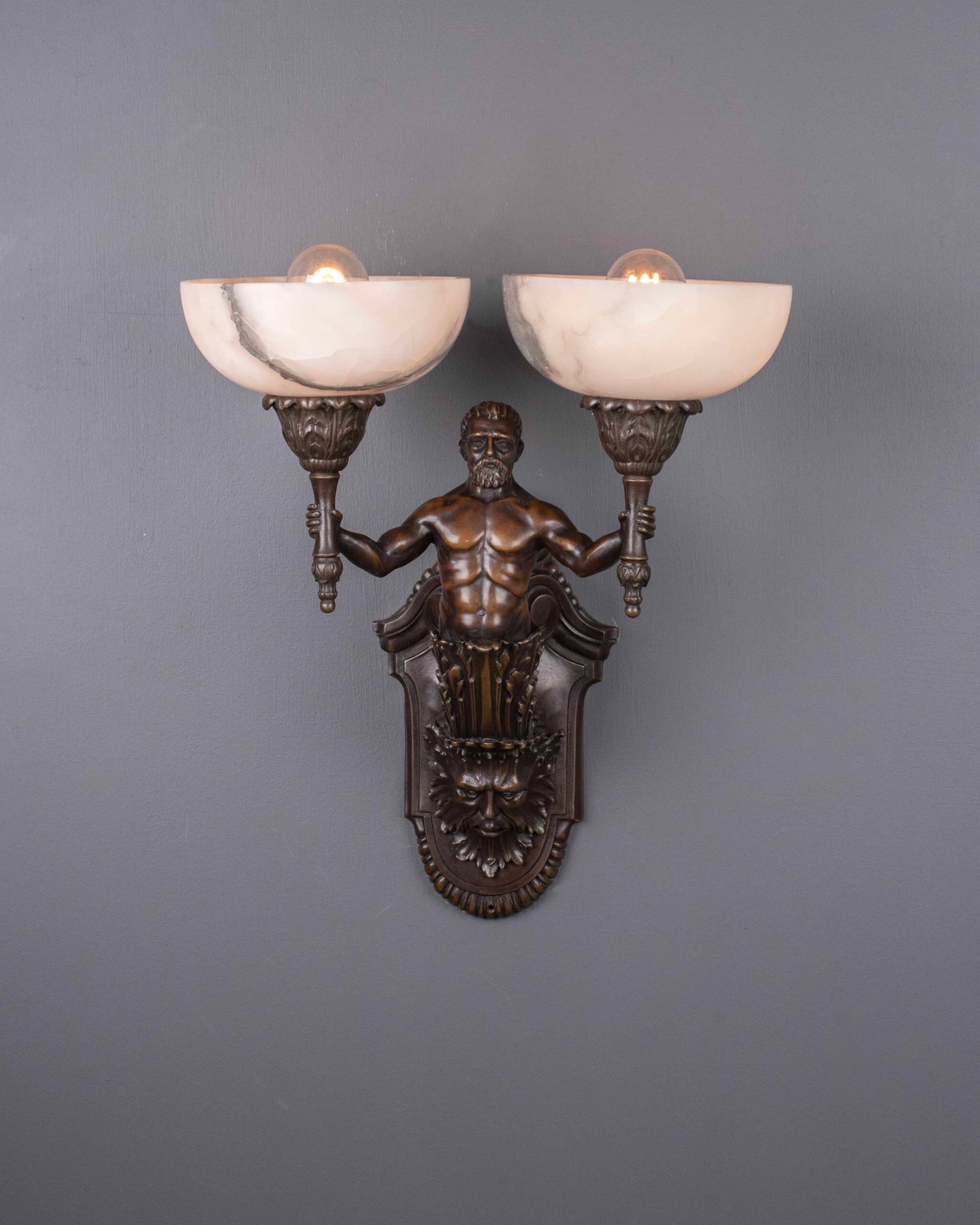 A fine pair of bronze antique wall sconces with alabaster bowls