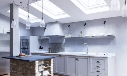 large ribbed Upton pendants over a kitchen island with looped flex