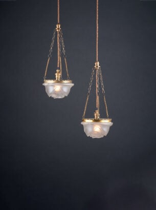 Delicate pair of French satin glass rose pendants with tiny glass chains on a dark background