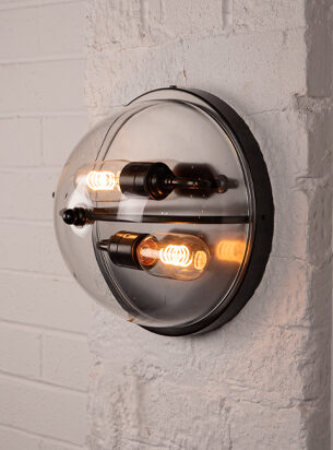 Fabulous designer wall light with bronze metal work and 2 lamps, flush fitted onto a brick wall