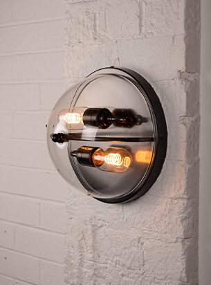 Office wall lighting can be traditional or contemporary, here the Grafton flush wall light makes a steampunk addition to a rustic office