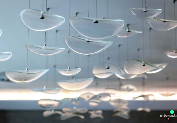 Modern office featuring bespoke lighting installation by Fritz Fryer Lighting